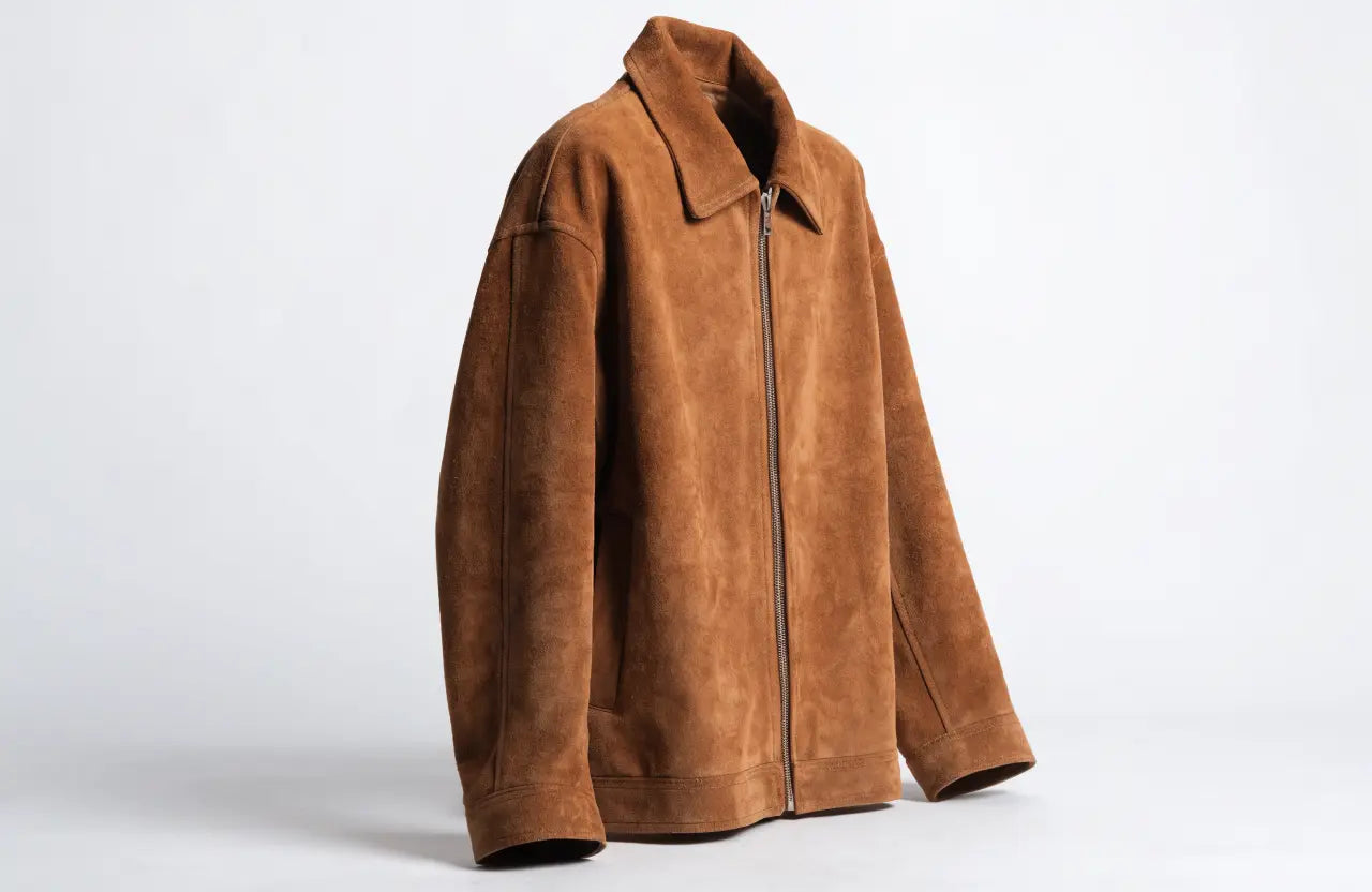 Tan brown suede jacket with a soft matte texture, studio product shot